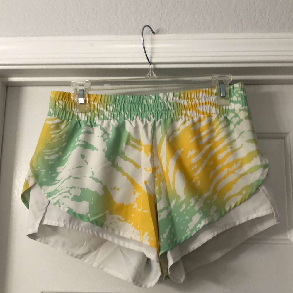 Green and yellow running shorts